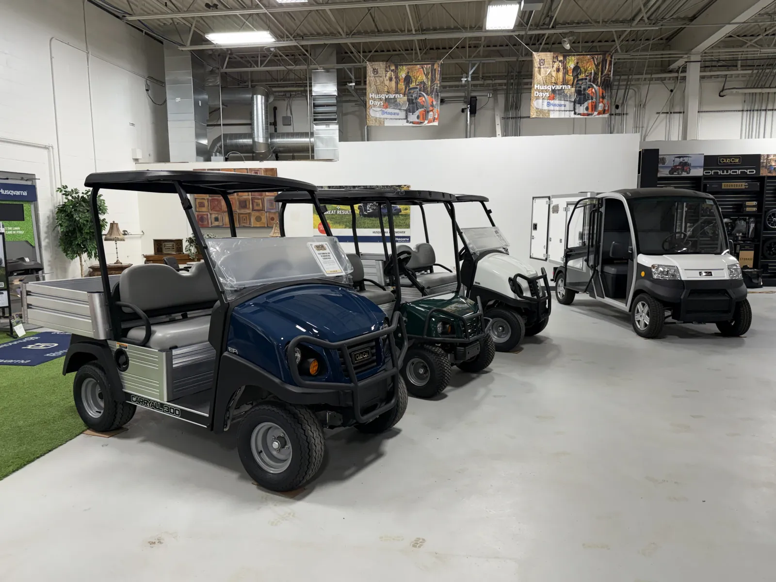 MOR Golf and Utility showroom utility vehicle area featuring Club Car Carryall and Urban LSV